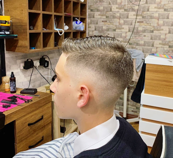 Textured quiff haircut with skin fade at Junction Barbers, Watford